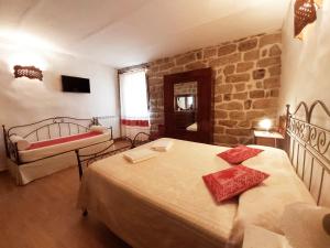 Postel nebo postele na pokoji v ubytování Al Vecchio Corso B&B