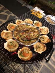 a grill with a plate of food on it at Saipan Skyline Designers Hotel in Saipan
