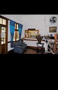 a living room with a couch and a mirror at Carsdale country lodge in Empangeni