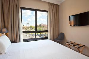 Postel nebo postele na pokoji v ubytování Amani Hotel Suites & Spa