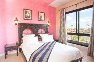 Postel nebo postele na pokoji v ubytování Amani Hotel Suites & Spa