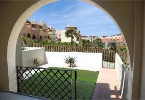 an archway in a building with a view of a yard at Zahara Sol Villas y Apartamentos by QHotels in Zahara de los Atunes