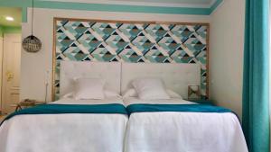 Posteľ alebo postele v izbe v ubytovaní Hotel Doña Blanca