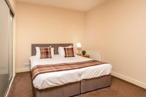 Кровать или кровати в номере Elliot Suite No 1 - Donnini Apartments