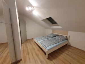 a small bedroom with a bed in a room at Beautiful City Apartment für bis 4 Personen in Paderborn