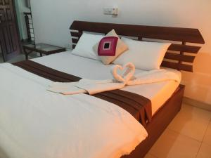 Ein Bett oder Betten in einem Zimmer der Unterkunft Why Not Palace