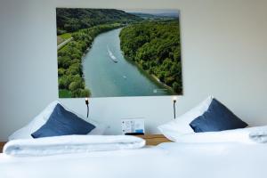 Postel nebo postele na pokoji v ubytování Hotel Frauenfeld