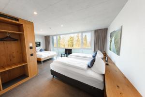 Postel nebo postele na pokoji v ubytování Hotel Frauenfeld