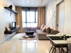 a living room with a couch and a table at I City Residence, 2 Bedroom 4-6 Pax unit, Walking to Theme n Water Park & Shopping Mall in Shah Alam