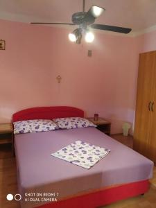 Postel nebo postele na pokoji v ubytování Holiday Home Ružmarin
