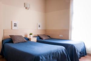 Posteľ alebo postele v izbe v ubytovaní Residencia Universitaria Resa Blas De Otero