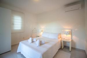 Ein Bett oder Betten in einem Zimmer der Unterkunft Villa Casiopea