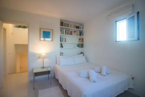 Ein Bett oder Betten in einem Zimmer der Unterkunft Villa Casiopea