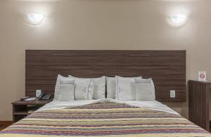 Cama ou camas em um quarto em Abba Hotel