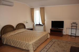 Postel nebo postele na pokoji v ubytování Domus Hotel-1