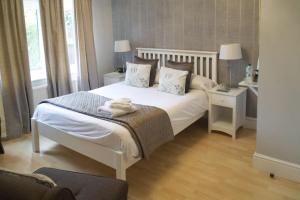 The Cambridge Guest House by Tas客房内的一张或多张床位