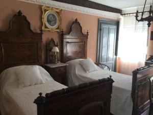 Posteľ alebo postele v izbe v ubytovaní Casa Ariis