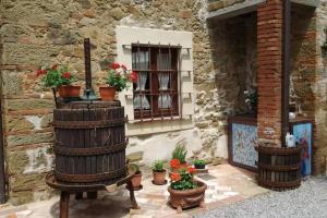 a building with a window with potted plants on it at Agriturismo Casariccio - Casa Viola in Bucine