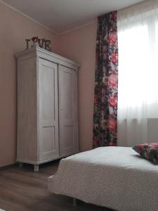 Postel nebo postele na pokoji v ubytování Kara Apartman