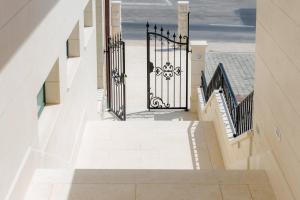 an overhead view of stairs with a wrought iron gate at Villa Kogo in Hvar