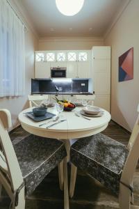 a kitchen with a table with two chairs and a dining room at Apartment Nena in Zadar