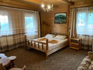 Postel nebo postele na pokoji v ubytování КРЕМІНЬ + 35 fotografií