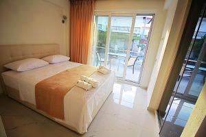 Posteľ alebo postele v izbe v ubytovaní Sky Rays Luxury Apartments