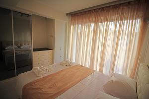 Posteľ alebo postele v izbe v ubytovaní Sky Rays Luxury Apartments