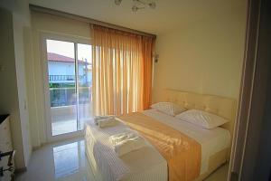 Posteľ alebo postele v izbe v ubytovaní Sky Rays Luxury Apartments
