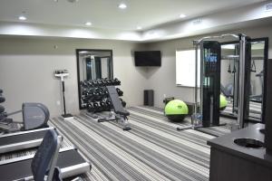 a fitness room with a gym with tread machines at Candlewood Suites Independence, an IHG Hotel in Selsa
