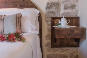 Letto o letti in una camera di Torre Don Virgilio Country Hotel