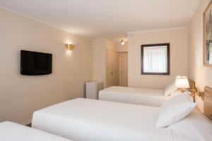 Postel nebo postele na pokoji v ubytování Alfa Suites - Montevideo