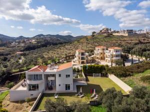 an aerial view of a house with a yard at Villa Familia Chania in Stalos