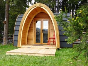 a small house with a red chair in it at Camping Wies-Neu in Dillingen