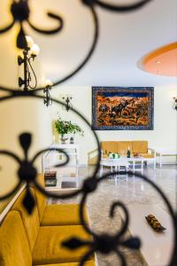 a living room with a couch and a table at Oasis Studios in Malia