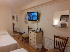 A bed or beds in a room at Athlumney Manor Guest Accommodation