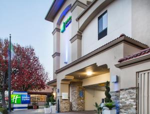 a hotel building with a sign on it at Holiday Inn Express Redwood City Central, an IHG Hotel in Redwood City