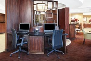 an office with two computers on a desk with chairs at Holiday Inn Express Hotels- Hampton, an IHG Hotel in Hampton