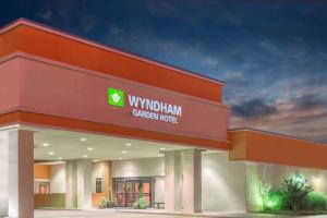 a rendering of a wgivingham general hospital building at Wyndham Garden OKC Airport - Event Center, Indoor pool, Arcade Near Paycom, Fairgrounds in Oklahoma City
