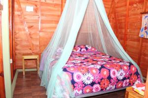 Säng eller sängar i ett rum på Yasipark - Nature Park und Ecolodge