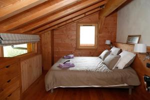 A bed or beds in a room at Prestigious Chalet