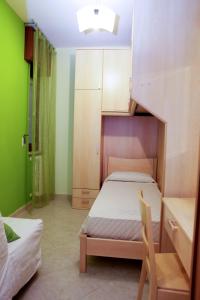 En eller flere senge i et værelse på Il Corallo casa vacanze