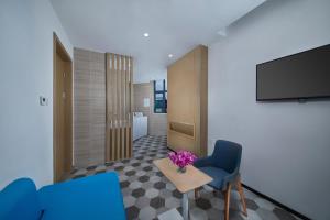 TV a/nebo společenská místnost v ubytování Holiday Inn Express Zhangjiagang East by IHG