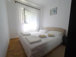 Postel nebo postele na pokoji v ubytování Vila Ruža