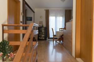 a room with a staircase and a living room at Vila Ruža in Ston