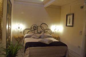 Posteľ alebo postele v izbe v ubytovaní B&B Il Sogno del Pinzagrilli