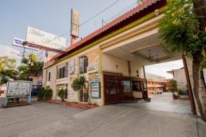 an old building with an open door on a street at Arisa in Oaxaca City