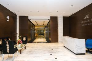 a lobby of a hotel with people sitting in chairs at LOVINA 17-11 at Harbour Bay Residences in Nagoya +26 photos