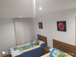 Łóżko lub łóżka w pokoju w obiekcie Apartemento Pablo