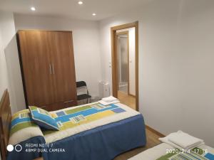 Łóżko lub łóżka w pokoju w obiekcie Apartemento Pablo